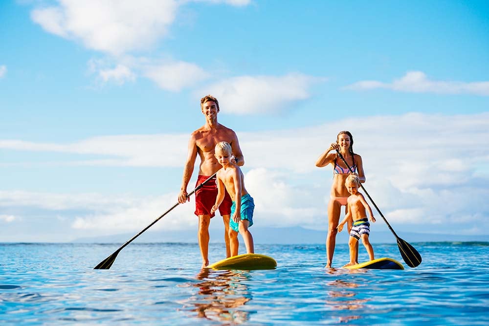 family enjoy and fun in stand up paddle board lessons