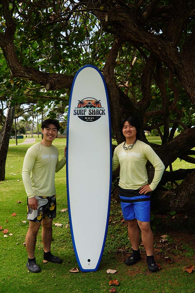 two man in kalama park with surfboard