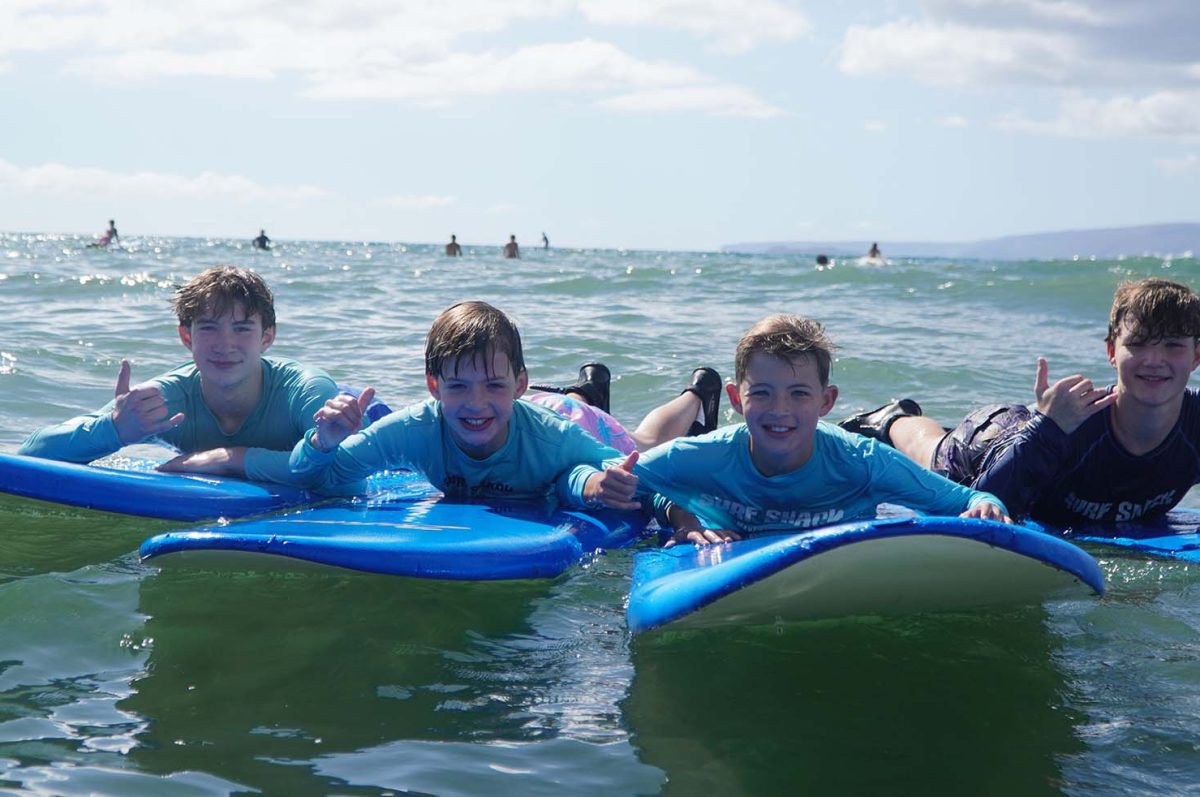 little-boys-enjoy-the-group-surfing-lessons Group of little boys enjoy the group surfing lessons